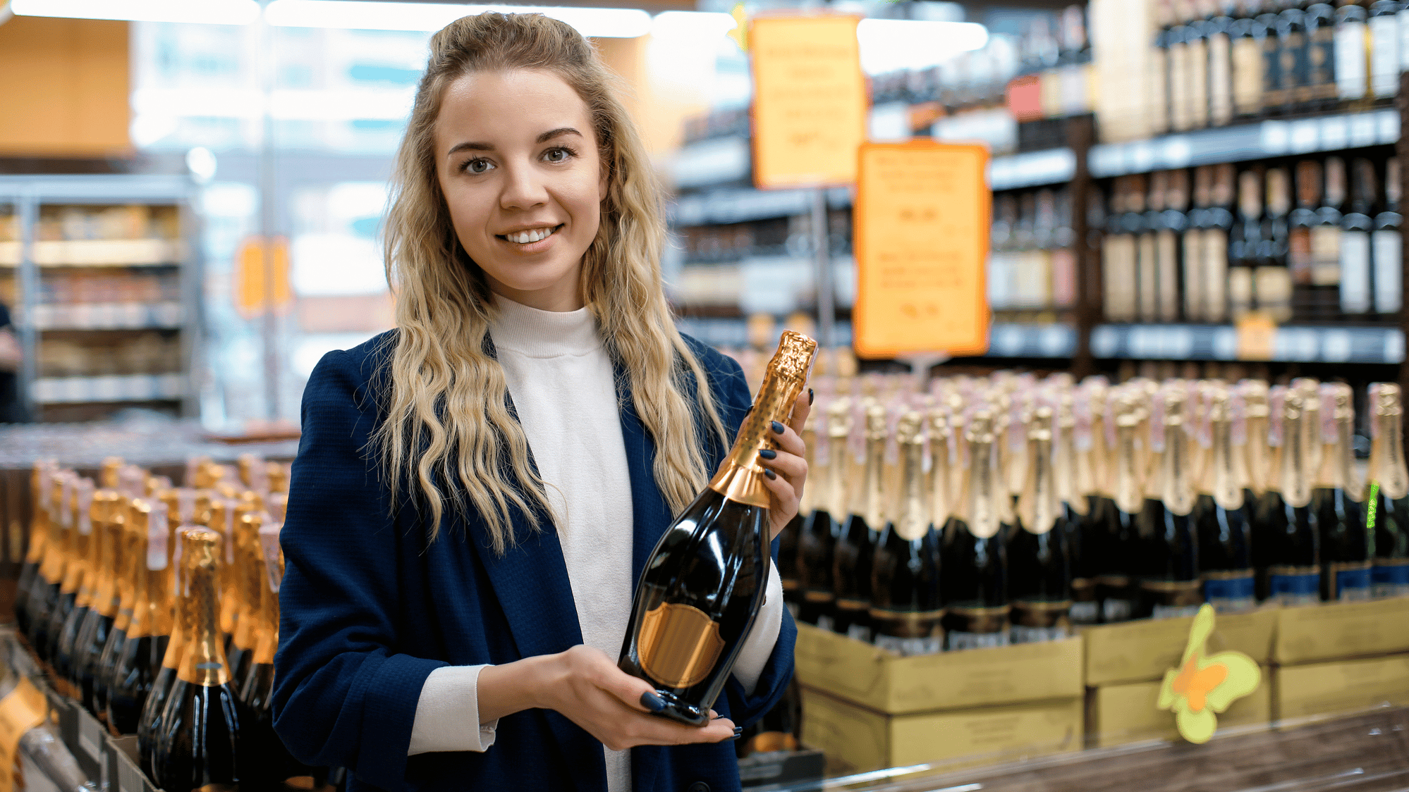 Small Business Owner Holding Wine Bottle