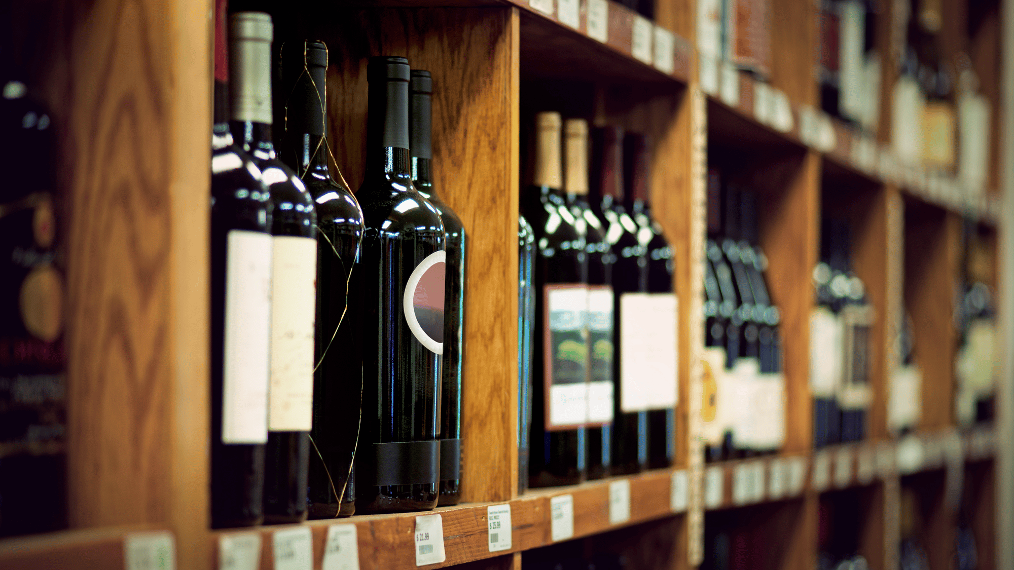 Shelves full of old wine bottles